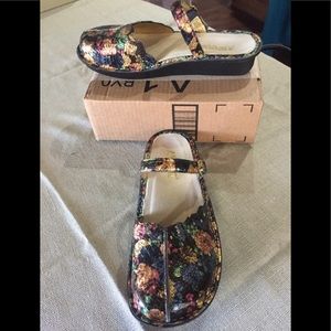 Black flower pattern Alegria sandals